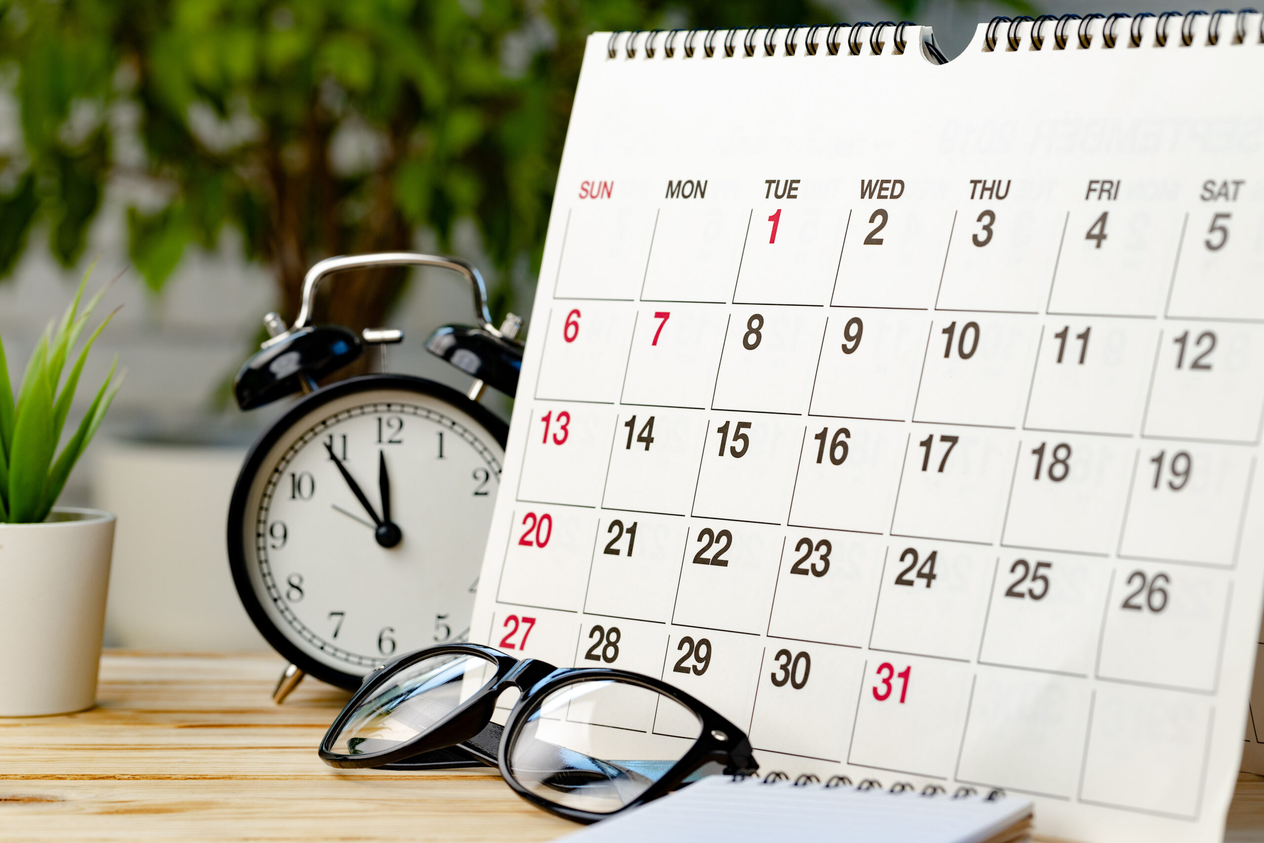 Calendar page close up on wooden office desk