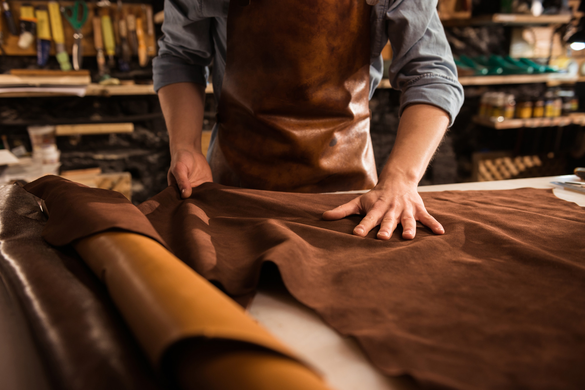 close-up-cobbler-working-with-leather-textile