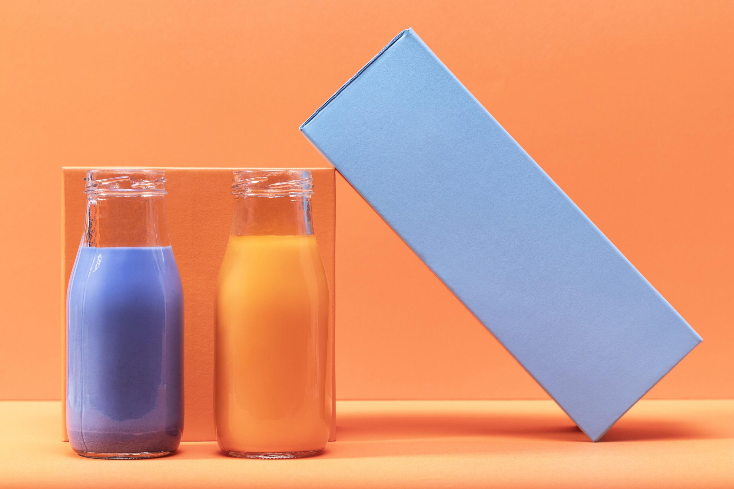 front-view-smoothies-glass-botles-with-decor