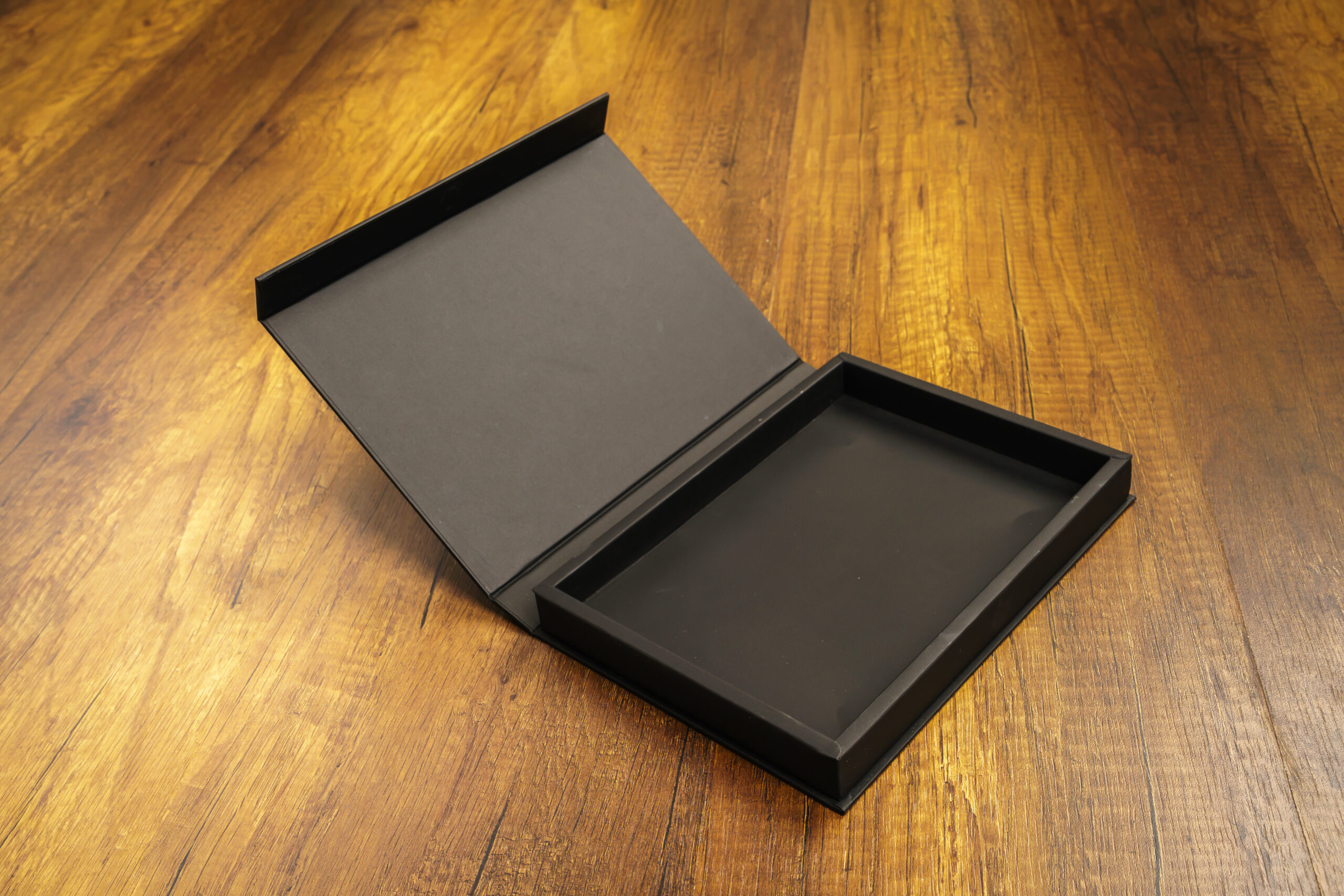 Blank black box mock up on wood background